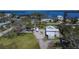 Aerial view of home with a circular driveway and ample parking at 1019 Canal St, Ruskin, FL 33570