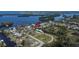Waterfront property featuring mature trees, boat docks, and quick access to a scenic bay at 1019 Canal St, Ruskin, FL 33570