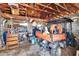 Interior shot of a cluttered garage featuring a Kubota 4x4 vehicle and various tools and equipment at 1019 Canal St, Ruskin, FL 33570