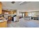Spacious kitchen and living area with wood cabinets and tile floors offer an inviting space at 1019 Canal St, Ruskin, FL 33570