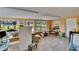Bright living room featuring tile flooring, large windows, neutral paint, and a view of the yard at 1019 Canal St, Ruskin, FL 33570