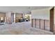 Damaged floor, wall and ceiling tiles are removed and needs renovation in the living room at 1019 Canal St, Ruskin, FL 33570