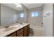 Bathroom featuring a double sink vanity and shower-tub combo at 10909 Observatory Way, Tampa, FL 33647