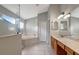 Bright bathroom features a soaking tub, a glass-enclosed shower, and a double vanity at 10909 Observatory Way, Tampa, FL 33647