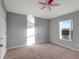 Bedroom featuring neutral walls, carpet floors, and a window overlooking a lake view at 10909 Observatory Way, Tampa, FL 33647