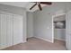 Cozy bedroom with a ceiling fan and a large closet for ample storage at 10909 Observatory Way, Tampa, FL 33647