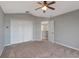 Bedroom featuring neutral walls, carpet floors, and a closet at 10909 Observatory Way, Tampa, FL 33647