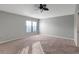 Spacious bedroom features carpet and a large window letting in lots of natural light at 10909 Observatory Way, Tampa, FL 33647