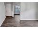 The foyer features hardwood floors, light grey walls, and a white entry door at 10909 Observatory Way, Tampa, FL 33647