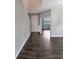 The foyer features hardwood floors, light grey walls, and a white entry door at 10909 Observatory Way, Tampa, FL 33647