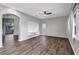 This living room features hardwood floors, light grey walls, and a ceiling fan at 10909 Observatory Way, Tampa, FL 33647