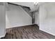 Open-concept living area with hardwood floors and neutral paint at 10909 Observatory Way, Tampa, FL 33647