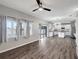 This living room features hardwood floors, light grey walls, and a view of the backyard at 10909 Observatory Way, Tampa, FL 33647