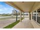 Covered patio featuring a basketball hoop and view of the fenced-in backyard, ideal for relaxation and entertainment at 10909 Observatory Way, Tampa, FL 33647