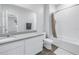 Bright bathroom with a shower and tub combo, large mirror, and vanity with gray countertop at 1109 Lady Gouldian Ct, Tampa, FL 33613