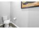 Cozy bathroom featuring a toilet, patterned flooring and charming wall art at 1109 Lady Gouldian Ct, Tampa, FL 33613