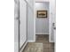 Bathroom with a glass enclosed shower, wood-look floors and a framed wall art at 1109 Lady Gouldian Ct, Tampa, FL 33613