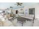 Clubhouse seating area featuring ceiling fans, tables, chairs, and sofas at 1109 Lady Gouldian Ct, Tampa, FL 33613