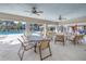 Relaxing clubhouse patio overlooking the pool, with ample seating at 1109 Lady Gouldian Ct, Tampa, FL 33613