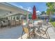 Elegant clubhouse patio with comfortable seating, palm trees, and pool view at 1109 Lady Gouldian Ct, Tampa, FL 33613