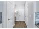 Hallway with multiple doors and neutral paint at 1109 Lady Gouldian Ct, Tampa, FL 33613