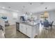 Spacious kitchen with an island overlooking the living and dining areas for seamless entertaining at 1109 Lady Gouldian Ct, Tampa, FL 33613