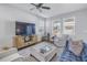 Bright living room with modern furniture, natural light, and a comfortable seating arrangement at 1109 Lady Gouldian Ct, Tampa, FL 33613