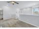 Loft area with neutral carpet, open railing, and view of a bedroom doorway at 1109 Lady Gouldian Ct, Tampa, FL 33613
