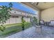 Covered patio with a fenced yard, pavers, plants and comfortable seating at 1109 Lady Gouldian Ct, Tampa, FL 33613