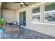 Covered patio with tile flooring and comfortable seating, great for outdoor relaxation at 1109 Lady Gouldian Ct, Tampa, FL 33613