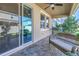 Covered outdoor patio features tile flooring and a grill, with a view of the fenced yard at 1109 Lady Gouldian Ct, Tampa, FL 33613