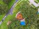 Aerial view of a playground offering a playset, picnic area, benches, and landscaped areas at 1204 Blackrush Dr, Tarpon Springs, FL 34689