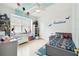 bedroom decorated with custom paint, a grey bed, and many toys at 1204 Blackrush Dr, Tarpon Springs, FL 34689