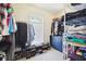 Walk-in closet with rods, shelves, dresser, and natural light at 1204 Blackrush Dr, Tarpon Springs, FL 34689