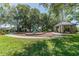 Community park featuring picnic area, lush green grass, playground and walkways for residents at 1204 Blackrush Dr, Tarpon Springs, FL 34689
