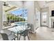 Dining area with view of screened-in pool and patio area at 1204 Blackrush Dr, Tarpon Springs, FL 34689
