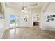 Bright, open-concept space with tile floors, arched doorways, and views of the lanai at 1204 Blackrush Dr, Tarpon Springs, FL 34689