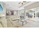 Bright living area featuring tile floors and sliding doors to the outdoor patio at 1204 Blackrush Dr, Tarpon Springs, FL 34689