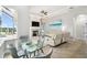 Living room view from the dining area showing fireplace and patio access at 1204 Blackrush Dr, Tarpon Springs, FL 34689