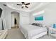 Cozy primary bedroom with tray ceiling, plush carpeting, and ample natural light at 1204 Blackrush Dr, Tarpon Springs, FL 34689