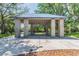 Covered picnic area with stone pillars and built-in picnic tables at 1204 Blackrush Dr, Tarpon Springs, FL 34689