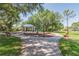 Community playground featuring a play structure and a covered picnic area at 1204 Blackrush Dr, Tarpon Springs, FL 34689