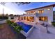 Beautiful backyard with a modern pool, covered patio, and ample space for outdoor relaxation at 1401 Brightwaters Ne Blvd, St Petersburg, FL 33704