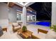 An outdoor space with a lounge and dining area boasts a luxurious pool, perfect for entertaining and relaxation at 1401 Brightwaters Ne Blvd, St Petersburg, FL 33704