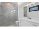 Modern bathroom with glass-enclosed shower, marble accents, and sleek fixtures and a modern vanity at 1401 Brightwaters Ne Blvd, St Petersburg, FL 33704
