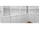 Custom walk-in closet featuring built-in shelving, drawers, and ample storage space at 1401 Brightwaters Ne Blvd, St Petersburg, FL 33704
