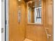 Interior view of residential elevator features wood paneling, a mirror, and control panel at 1401 Brightwaters Ne Blvd, St Petersburg, FL 33704