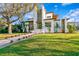 Modern two-story home boasting clean lines, wood accents, and a well-manicured lawn at 1401 Brightwaters Ne Blvd, St Petersburg, FL 33704
