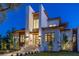 A modern two-story house with an inviting entrance and manicured landscaping in a well-lit front yard at 1401 Brightwaters Ne Blvd, St Petersburg, FL 33704