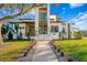 Striking modern home featuring clean lines, a grand entrance, and professional landscaping at 1401 Brightwaters Ne Blvd, St Petersburg, FL 33704